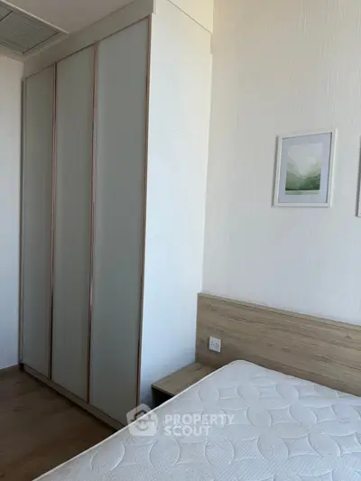 Cozy bedroom with modern wardrobe and minimalist decor