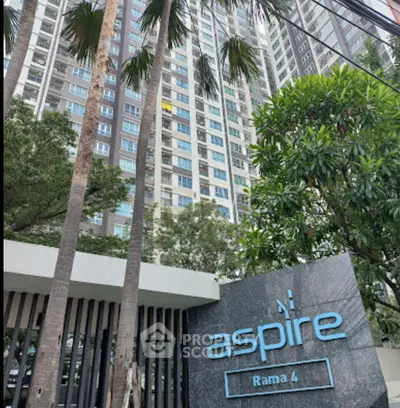 Modern high-rise building with lush greenery at Aspire Rama 4, ideal urban living.