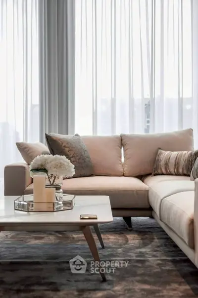 Elegant living room with plush sofa and stylish decor, perfect for modern living.