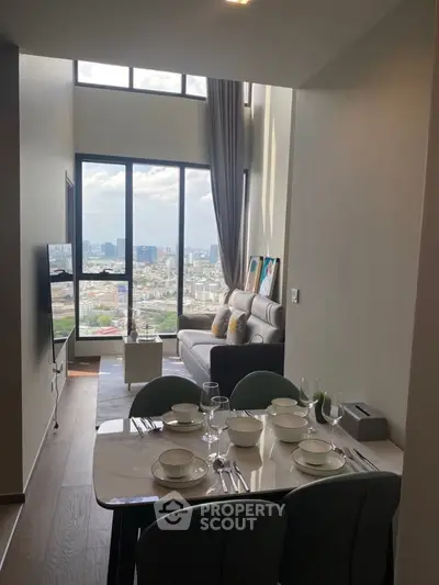 Stunning high-rise living room with floor-to-ceiling windows and city view