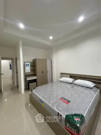 Modern bedroom with sleek design and ample storage space