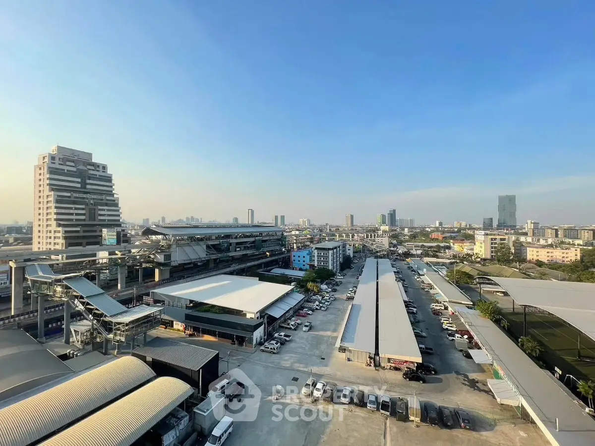 Stunning cityscape view with modern buildings and clear blue sky, perfect for urban living.