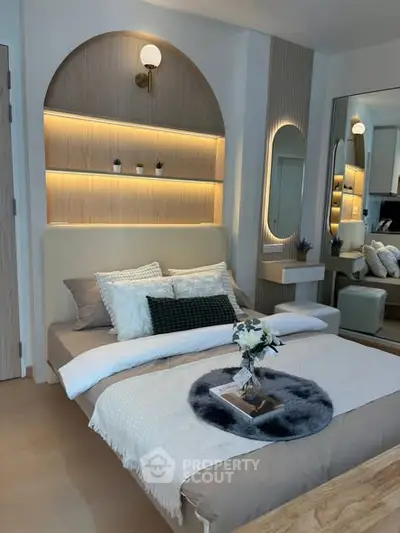 Stylish modern bedroom with elegant lighting and cozy decor
