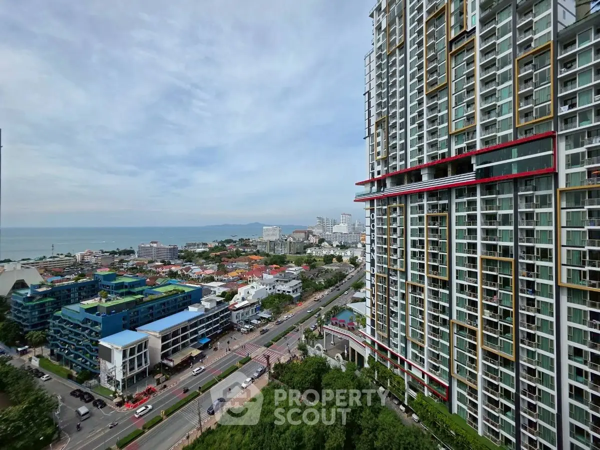 Stunning high-rise building with ocean view in vibrant cityscape.