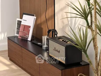 Stylish modern living room with sleek wooden cabinet and trendy decor elements.