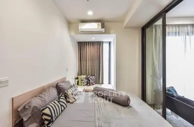 Modern bedroom with balcony access and stylish decor