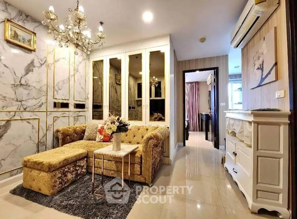 Luxurious living room with elegant decor and plush furnishings in a modern apartment.