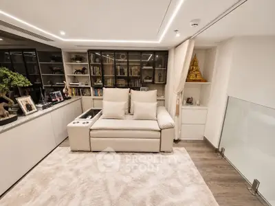 Luxurious living room with plush sofa, elegant shelving, and ambient lighting for a cozy atmosphere.