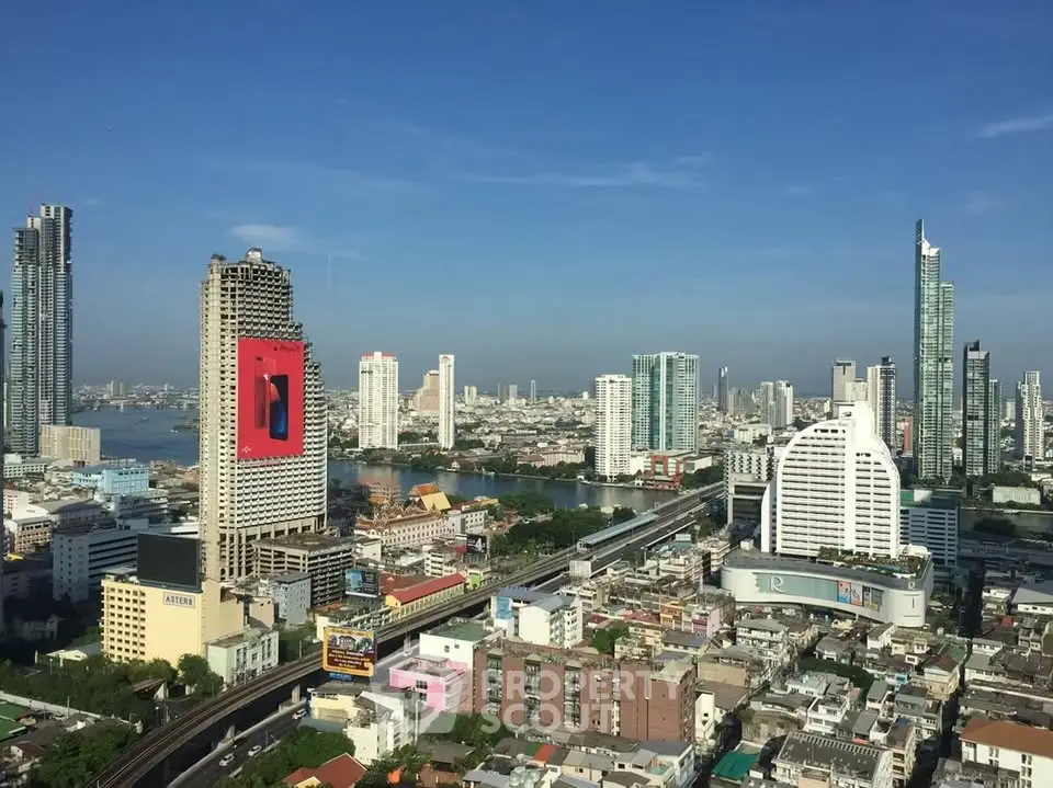 Stunning cityscape view showcasing modern skyscrapers and urban skyline under a clear blue sky.