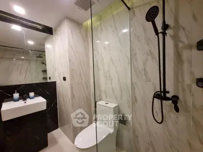 Luxurious modern bathroom with sleek marble tiles and elegant fixtures