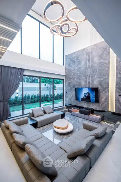 Luxurious modern living room with high ceilings and elegant decor