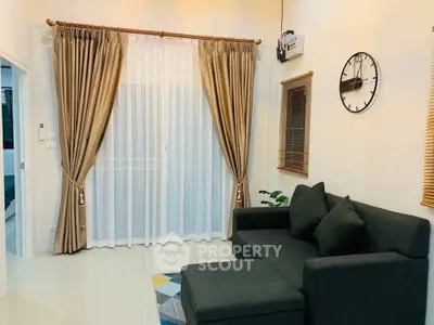 Modern living room with elegant curtains and stylish sofa