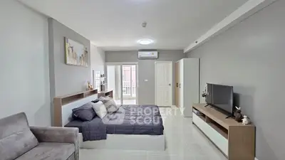 Modern bedroom with sleek design, featuring a cozy bed, stylish furniture, and neutral color palette.