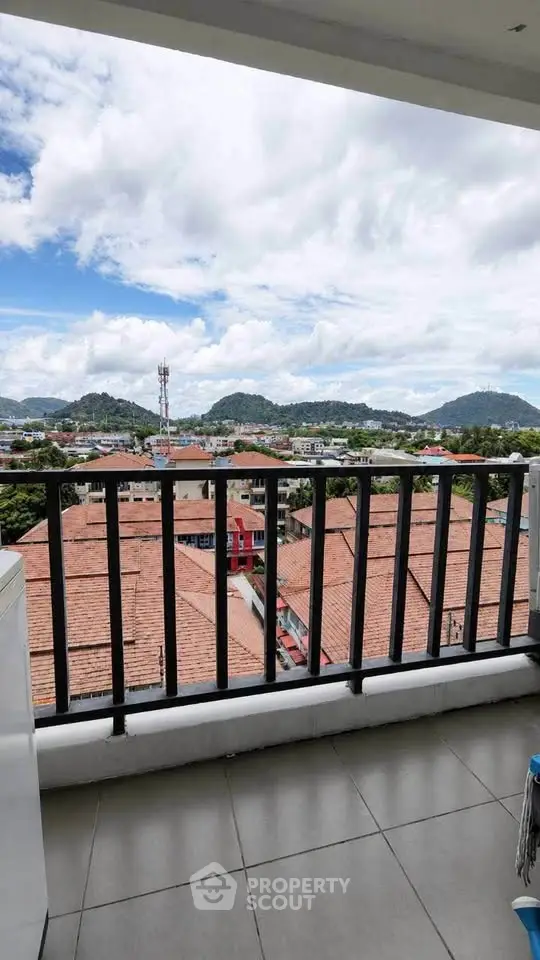 Stunning balcony view with scenic landscape and city skyline, perfect for relaxation.