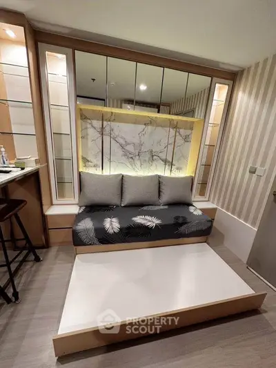 Modern living room with stylish sofa and elegant marble accent wall