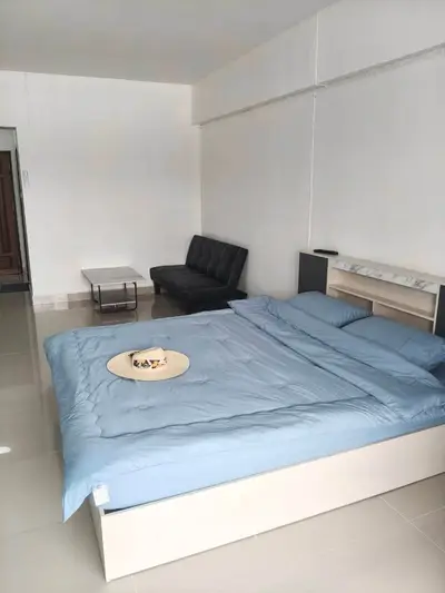 Spacious bedroom with modern furnishings and sleek design