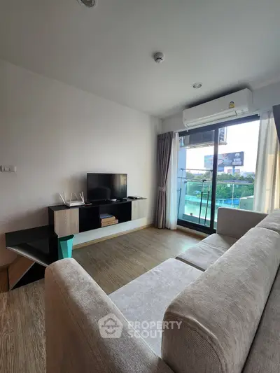 Modern living room with sleek furniture and balcony view