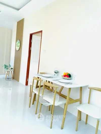 Bright dining area with modern wooden furniture and minimalist decor