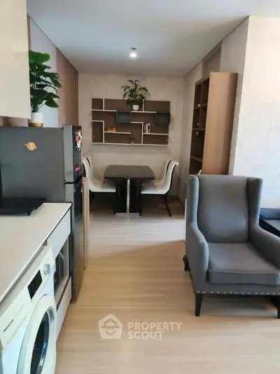 Modern open-plan living room with stylish furniture and built-in shelving