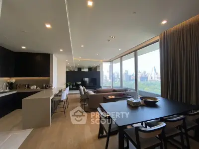 Luxurious open-plan living room with stunning city view and modern kitchen