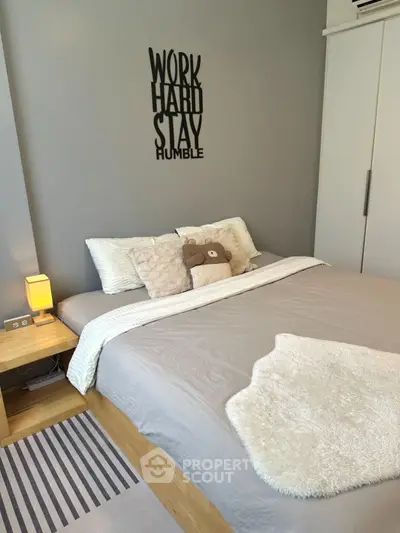 Cozy bedroom with modern decor and motivational wall art