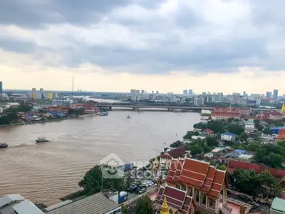 Stunning river view from high-rise apartment in vibrant cityscape