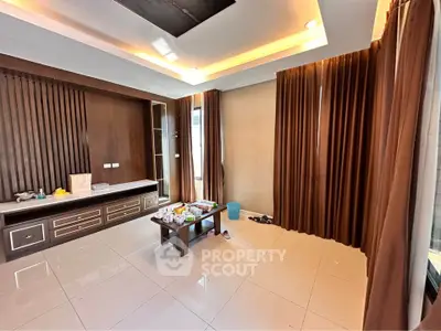 Spacious living room with modern design and large windows for natural light.