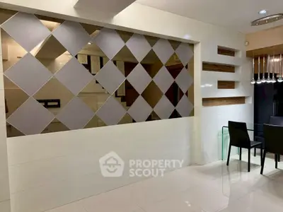 Modern interior with stylish partition wall and sleek dining area, perfect for contemporary living.
