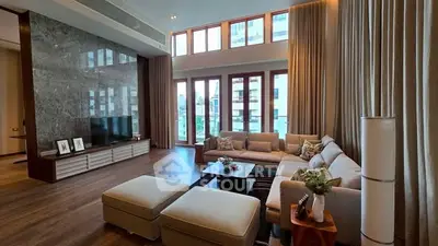 Luxurious living room with high ceilings and elegant decor in modern apartment