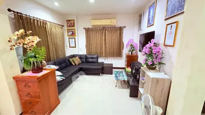 Cozy living room with modern black sofa and elegant decor