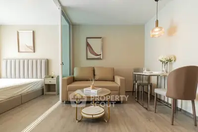 Modern living room with elegant decor and cozy seating area in a stylish apartment.