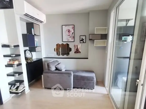 Modern living room with stylish decor and comfortable seating in a cozy apartment.