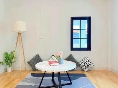 Charming minimalist living room with cozy decor and natural light