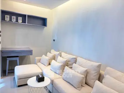 Cozy living room with plush beige sofa and modern decor