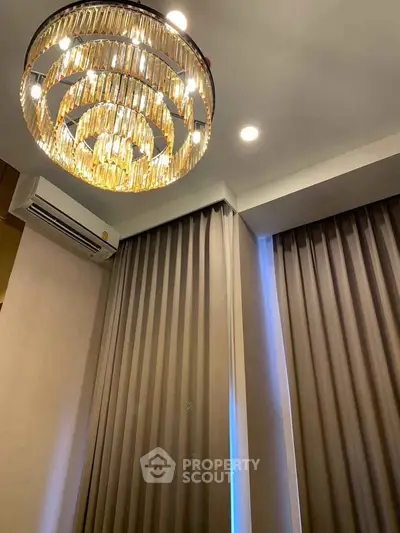 Elegant interior with luxurious chandelier and modern curtains