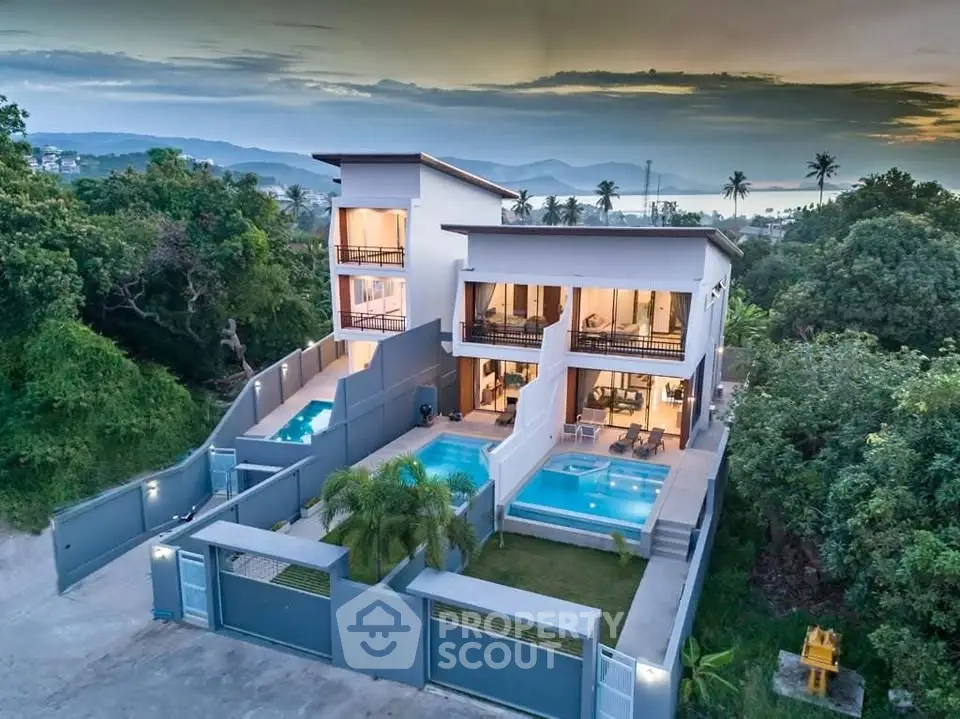 Luxurious modern villa with private pools and stunning sunset view