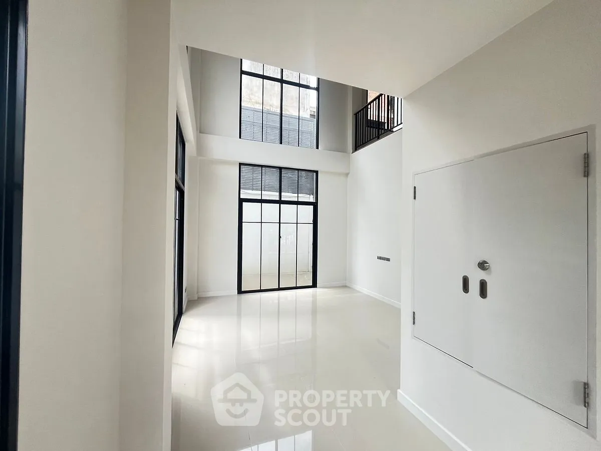 Spacious modern interior with high ceilings and large windows