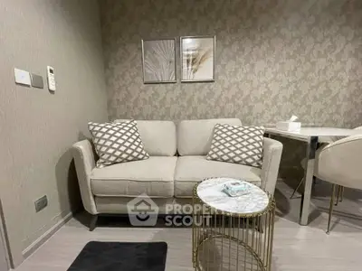 Cozy living room with elegant sofa and stylish decor in modern apartment.