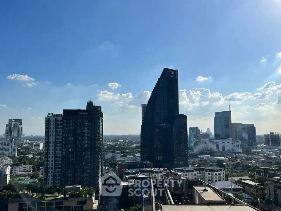 Stunning cityscape view showcasing modern skyscrapers under a clear blue sky, perfect for urban living.