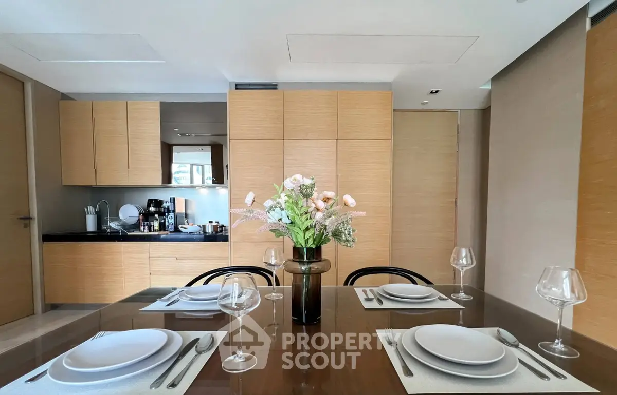 Elegant dining area with modern kitchen and stylish decor