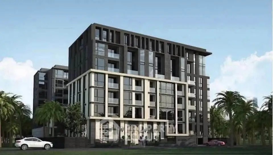 Modern apartment building with sleek design and large windows, surrounded by palm trees.