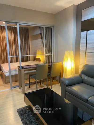 Modern living room with sleek furniture and cozy lighting in a stylish apartment.
