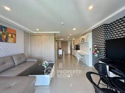Spacious modern living room with open kitchen and stylish decor