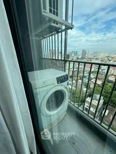 High-rise balcony with washing machine and stunning city view