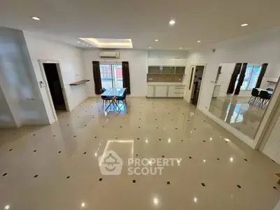 Spacious open-plan living area with modern kitchen and dining space.