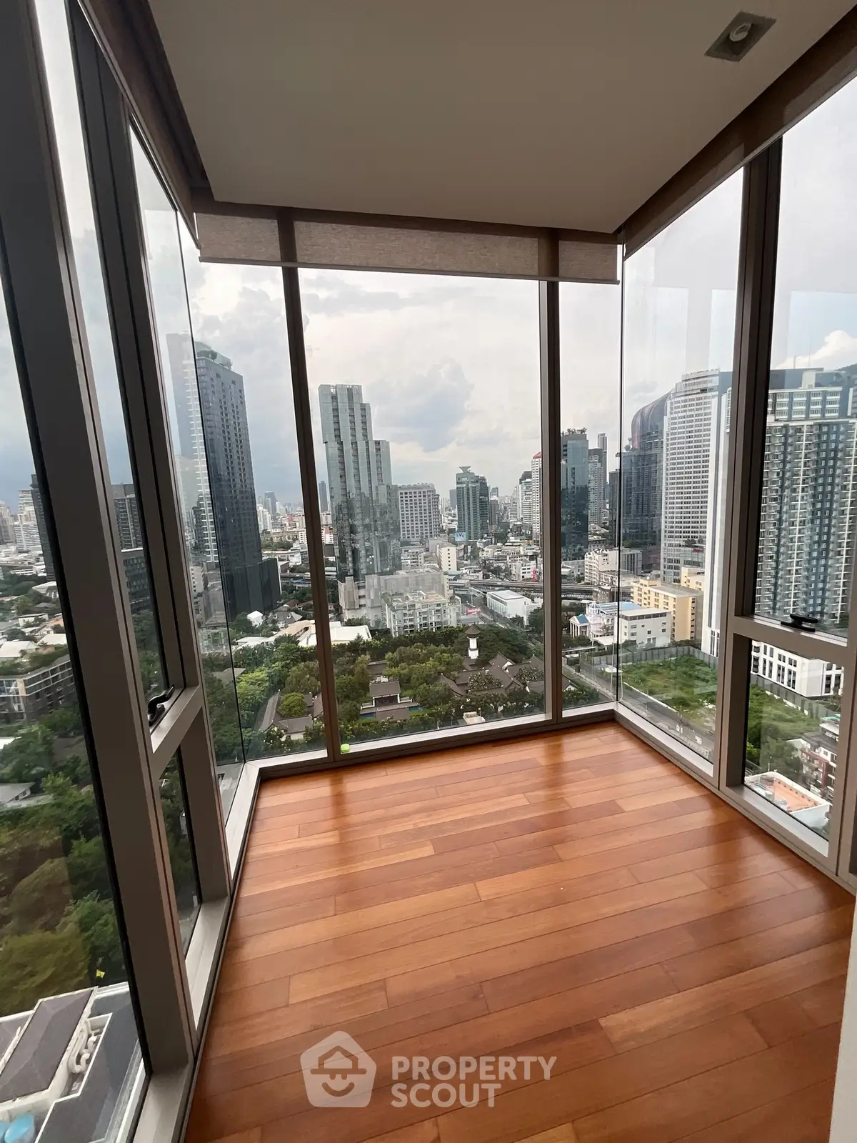 Stunning corner unit with panoramic city views and floor-to-ceiling windows.