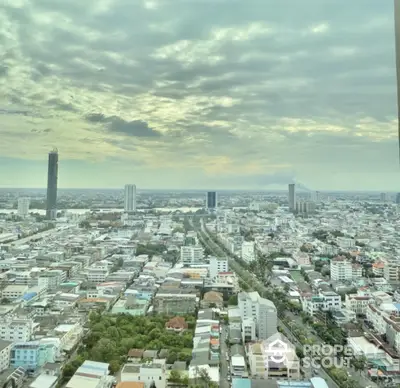 Stunning cityscape view from high-rise building showcasing urban skyline and expansive horizon.