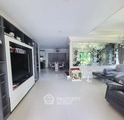 Spacious modern living room with elegant decor and large TV unit