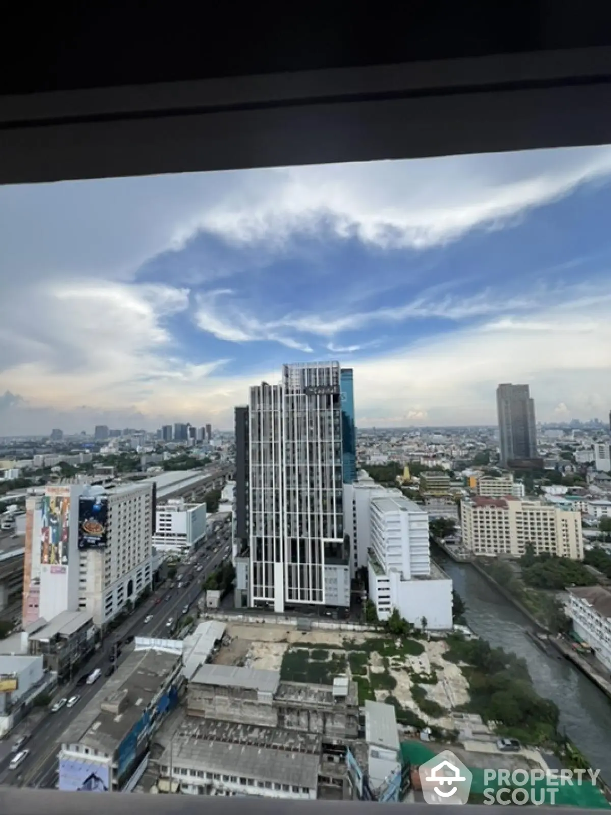 Stunning cityscape view from high-rise building with expansive skyline and urban landscape.