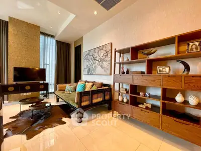 Luxurious living room with elegant decor and modern furniture, featuring a stylish TV setup and artistic shelving.